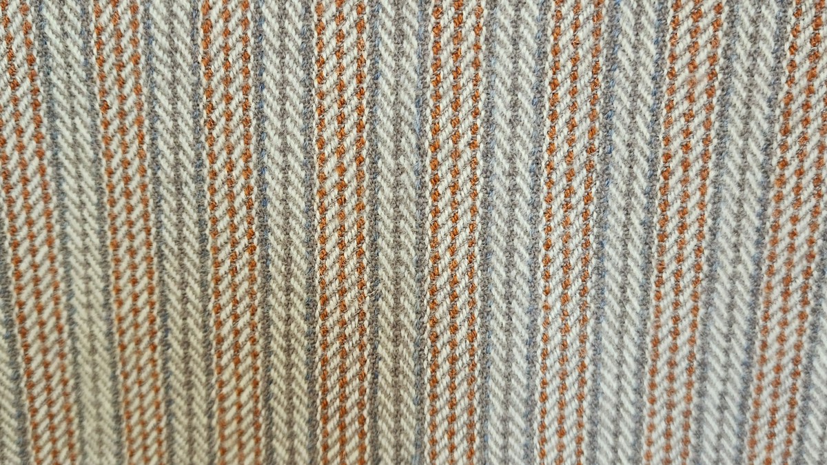 Woven herringbone stripe in blue-grey, ivory and rust
