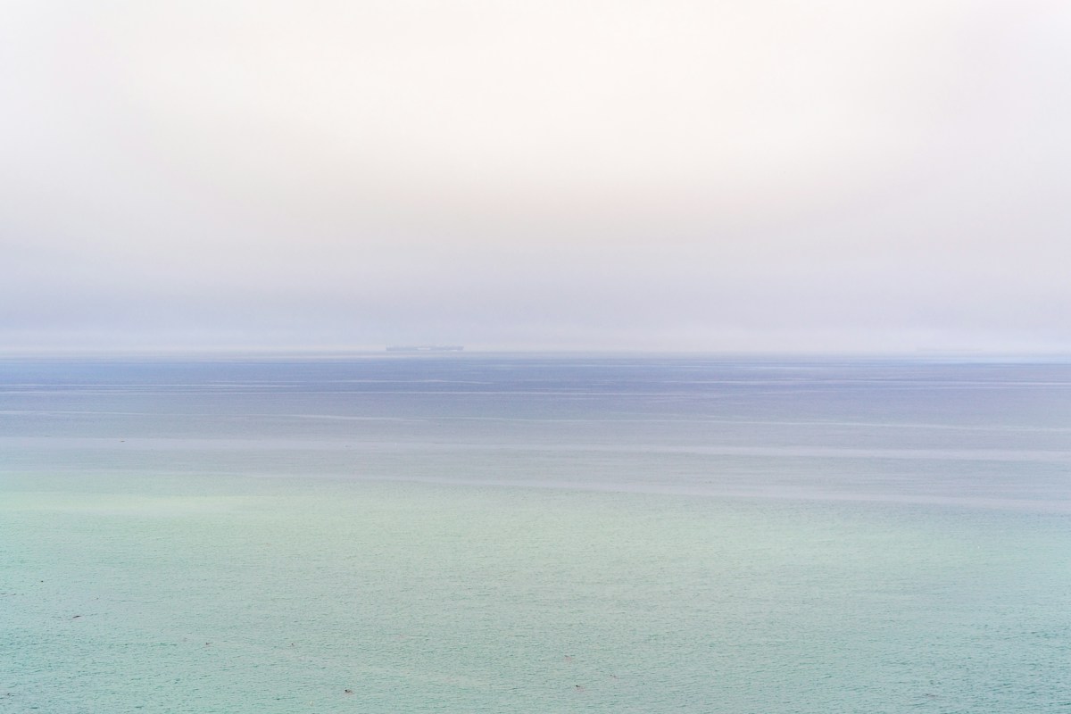 Calm, misty blue-green sea